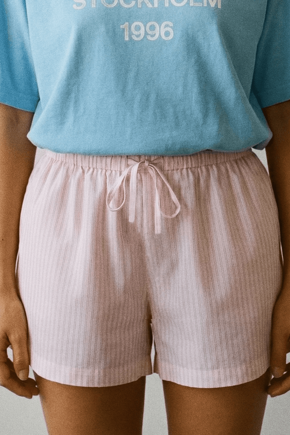 Blue T-shirt and pink shorts detail